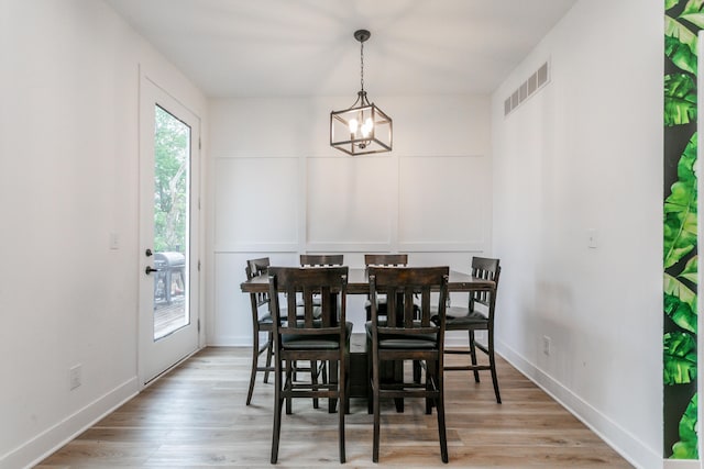 210 Hickam Aly, Ashland, MO 65010 - dining room featuring light wood finished floors and a chandelier