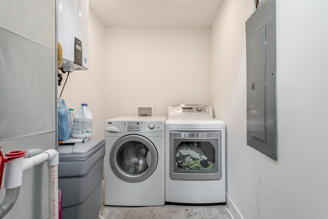 210 Hickam Aly, Ashland, MO 65010 - washroom with washing machine and dryer, tankless water heater, and electric panel