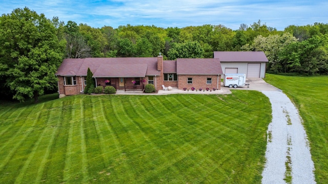 1820 N Hemlock Ridge Rd, Rocheport, MO 65279 - ranch-style house with a porch, a front yard, a chimney, a wooded view, and brick siding