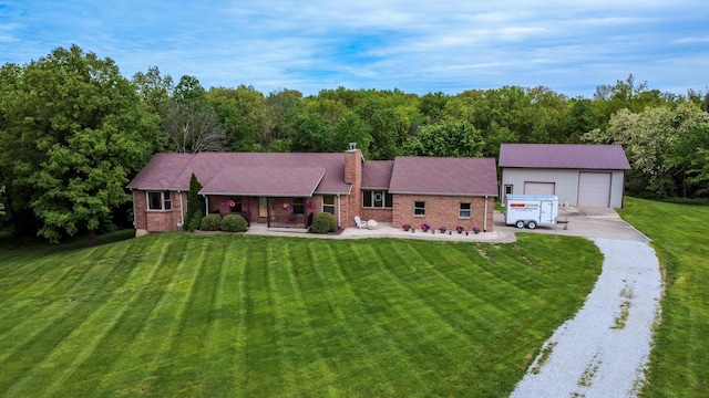 1820 N Hemlock Ridge Rd, Rocheport, MO 65279 - single story home with a front lawn, a porch, a garage, and a chimney