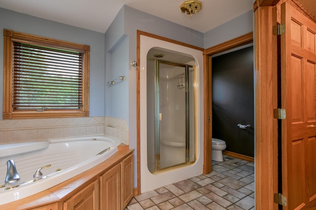 1820 N Hemlock Ridge Rd, Rocheport, MO 65279 - bathroom featuring toilet, a shower stall, a tub with jets, and brick patterned floors