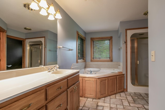 1820 N Hemlock Ridge Rd, Rocheport, MO 65279 - full bathroom with vanity, a garden tub, a stall shower, and stone finish floors