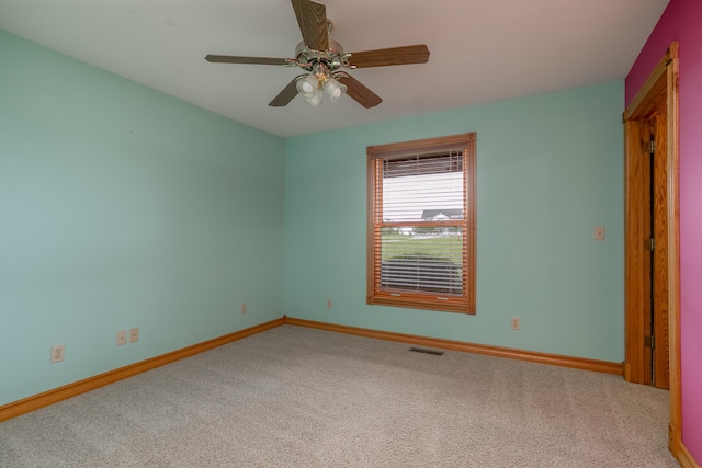 1820 N Hemlock Ridge Rd, Rocheport, MO 65279 - spare room featuring carpet floors, baseboards, and a ceiling fan