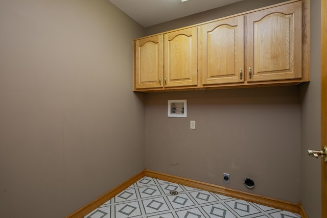 1820 N Hemlock Ridge Rd, Rocheport, MO 65279 - laundry area featuring cabinet space, washer hookup, electric dryer hookup, and baseboards
