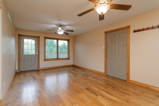 1820 N Hemlock Ridge Rd, Rocheport, MO 65279 - foyer with light wood finished floors, a ceiling fan, and baseboards