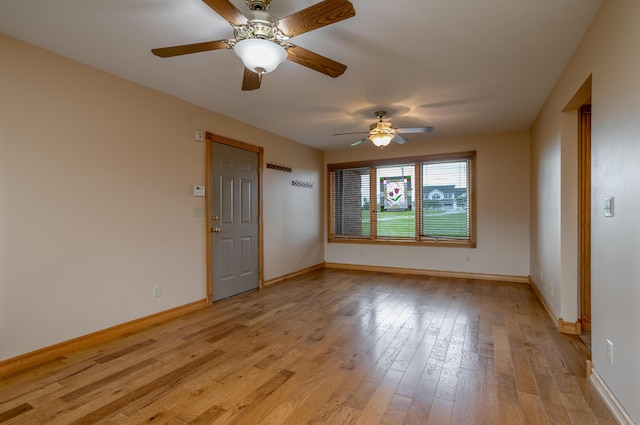 1820 N Hemlock Ridge Rd, Rocheport, MO 65279 - unfurnished room with ceiling fan, light wood finished floors, and baseboards