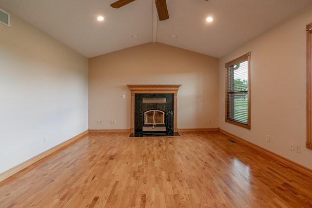 1820 N Hemlock Ridge Rd, Rocheport, MO 65279 - unfurnished living room with a ceiling fan, wood finished floors, a premium fireplace, lofted ceiling, and baseboards
