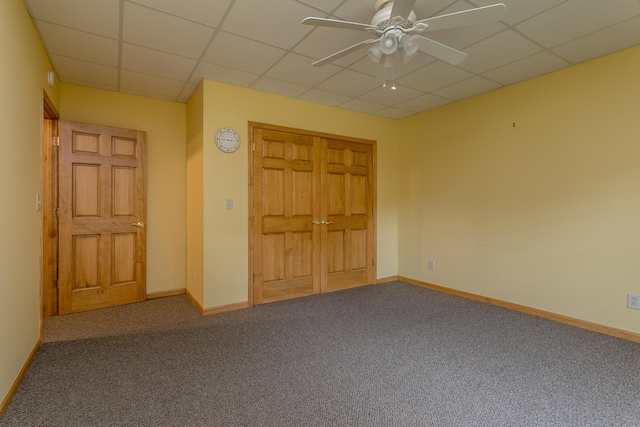 1820 N Hemlock Ridge Rd, Rocheport, MO 65279 - unfurnished bedroom with carpet flooring, a paneled ceiling, baseboards, a closet, and a ceiling fan