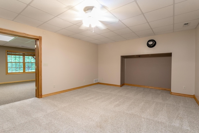 1820 N Hemlock Ridge Rd, Rocheport, MO 65279 - spare room with a drop ceiling, light colored carpet, and baseboards