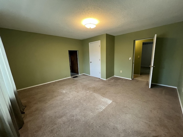 112 W 6th St, Fulton, MO 65251 - unfurnished bedroom with carpet flooring, a textured ceiling, and baseboards