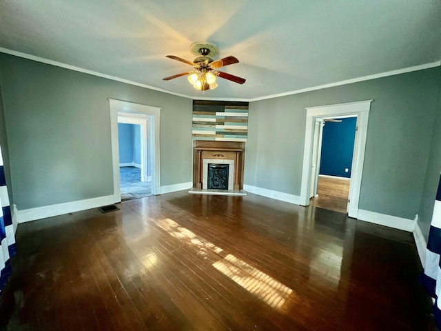 112 W 6th St, Fulton, MO 65251 - unfurnished living room with a ceiling fan, hardwood / wood-style flooring, ornamental molding, a fireplace with raised hearth, and baseboards