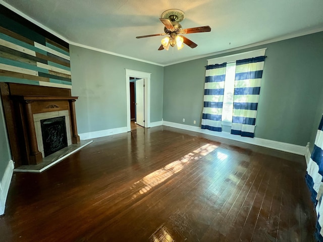112 W 6th St, Fulton, MO 65251 - unfurnished living room featuring wood-type flooring, ceiling fan, a fireplace with raised hearth, crown molding, and baseboards
