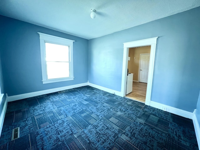 112 W 6th St, Fulton, MO 65251 - carpeted spare room featuring baseboards