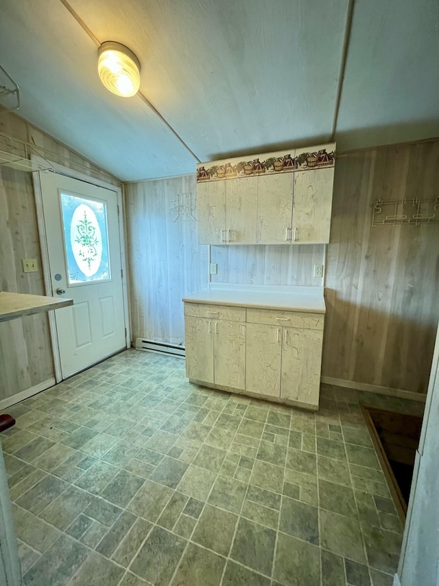 112 W 6th St, Fulton, MO 65251 - kitchen featuring wood walls, a baseboard radiator, and light countertops