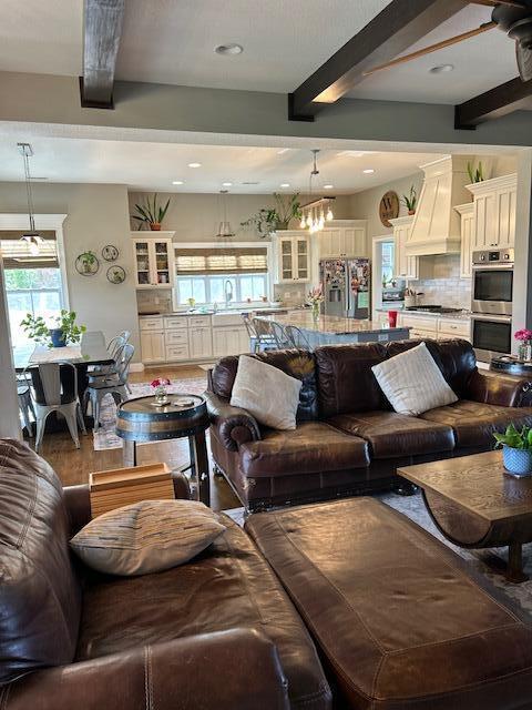 15172 S Henry Ln, Ashland, MO 65010 - living area featuring beam ceiling, wood finished floors, and recessed lighting