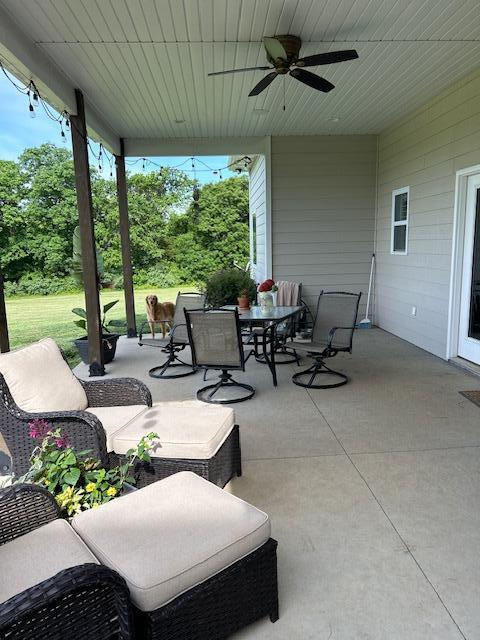 15172 S Henry Ln, Ashland, MO 65010 - view of patio featuring outdoor dining space and ceiling fan