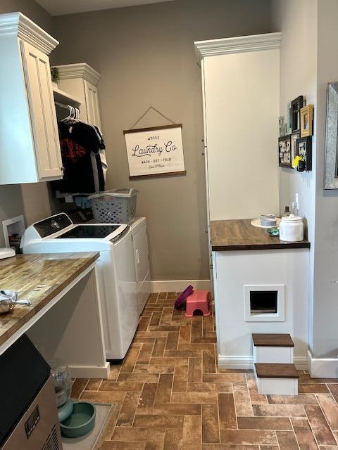 15172 S Henry Ln, Ashland, MO 65010 - laundry room with cabinet space, washing machine and clothes dryer, baseboards, and brick patterned floors