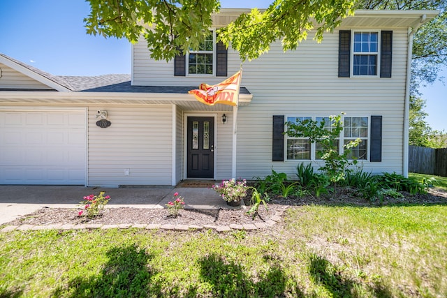 170 E Crest Ct, Columbia, MO 65202 - view of front facade featuring an attached garage, a front lawn, and a shingled roof