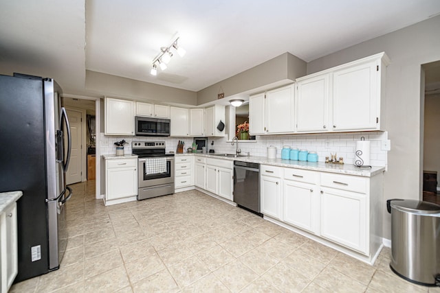 170 E Crest Ct, Columbia, MO 65202 - kitchen featuring stainless steel appliances, backsplash, white cabinets, and a sink