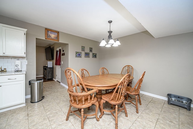 170 E Crest Ct, Columbia, MO 65202 - dining area featuring a chandelier, light tile patterned flooring, and baseboards
