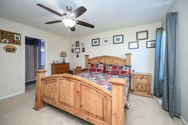 170 E Crest Ct, Columbia, MO 65202 - bedroom featuring light colored carpet, baseboards, ceiling fan, and connected bathroom