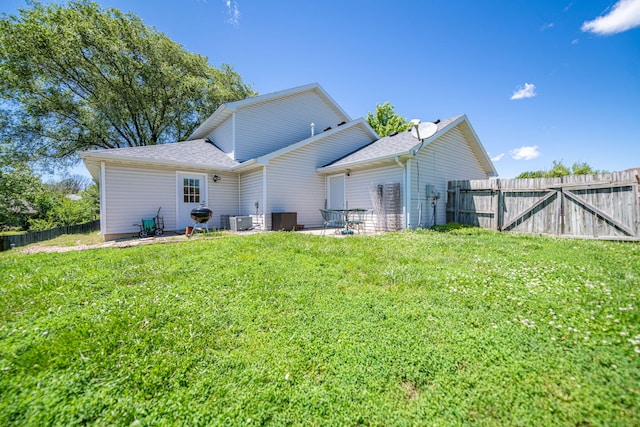 170 E Crest Ct, Columbia, MO 65202 - back of property with roof with shingles and cooling unit