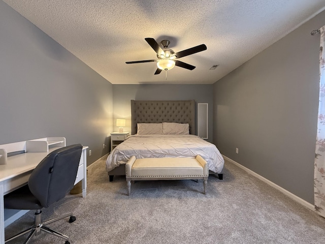 500 Columbia Dr Unit D, Columbia, MO 65203 - bedroom with carpet flooring, a textured ceiling, an office area, ceiling fan, and baseboards