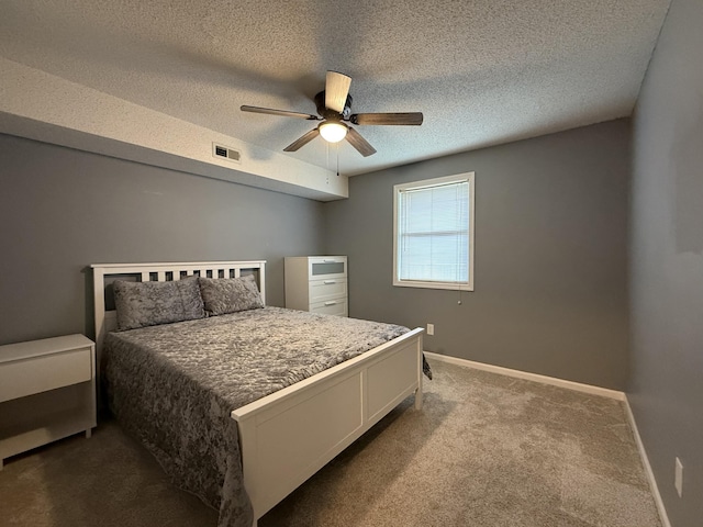 500 Columbia Dr Unit D, Columbia, MO 65203 - bedroom with carpet, a textured ceiling, baseboards, and a ceiling fan