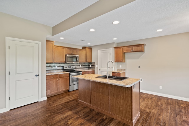 15620 Allegiance Ave, Ashland, MO 65010 - kitchen with stainless steel appliances, a sink, dark wood-style floors, brown cabinets, and recessed lighting