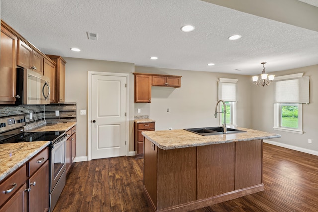 15620 Allegiance Ave, Ashland, MO 65010 - kitchen featuring stainless steel appliances, a sink, dark wood finished floors, brown cabinets, and baseboards
