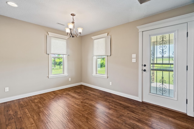 15620 Allegiance Ave, Ashland, MO 65010 - entryway featuring a chandelier, hardwood / wood-style flooring, and baseboards