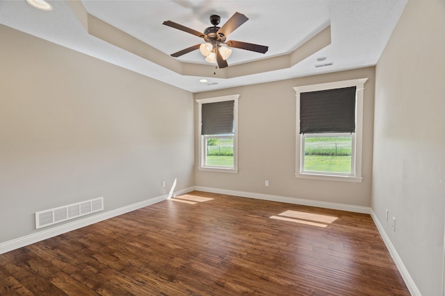 15620 Allegiance Ave, Ashland, MO 65010 - empty room with a tray ceiling, a ceiling fan, wood finished floors, baseboards, and recessed lighting