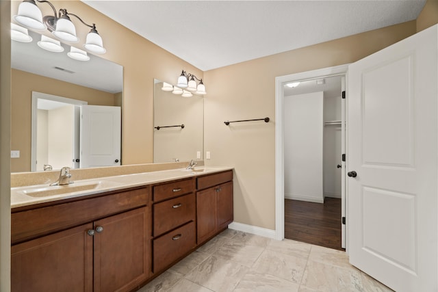 15620 Allegiance Ave, Ashland, MO 65010 - full bath featuring double vanity, marble finish flooring, and baseboards