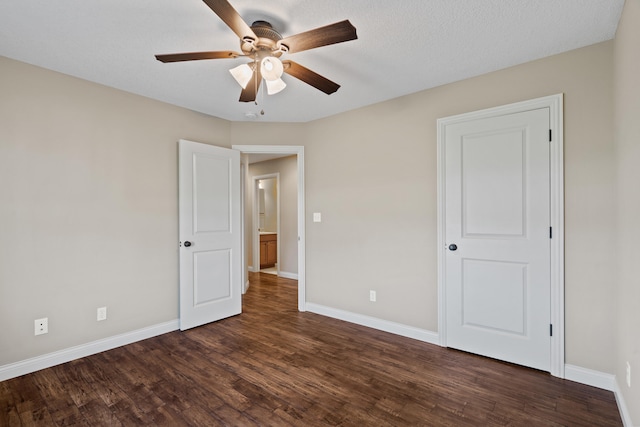 15620 Allegiance Ave, Ashland, MO 65010 - unfurnished bedroom featuring baseboards, dark wood-style floors, and ceiling fan