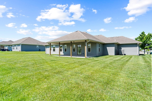 15620 Allegiance Ave, Ashland, MO 65010 - rear view of house featuring a yard, a patio area, and a shingled roof