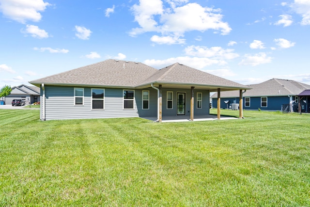 15620 Allegiance Ave, Ashland, MO 65010 - rear view of house with a shingled roof, a patio area, and a yard