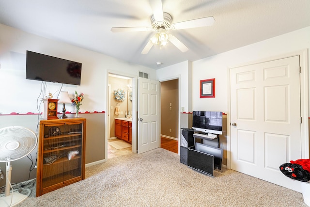 2803 Wooded Creek Dr, Columbia, MO 65203 - bedroom featuring light colored carpet, baseboards, a ceiling fan, and ensuite bath
