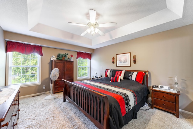 2803 Wooded Creek Dr, Columbia, MO 65203 - bedroom with a raised ceiling, light colored carpet, baseboards, and ceiling fan