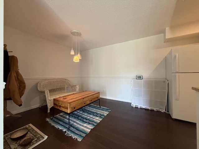 1999 N Waterfront Dr Unit H, Columbia, MO 65202 - dining space with wood finished floors, baseboards, and a textured ceiling