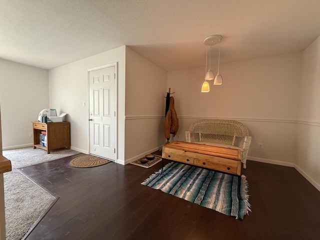 1999 N Waterfront Dr Unit H, Columbia, MO 65202 - living area featuring baseboards, wood finished floors, and a textured ceiling