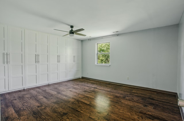 509 Columbia Dr Unit B, Columbia, MO 65201 - unfurnished bedroom with dark wood finished floors and a ceiling fan