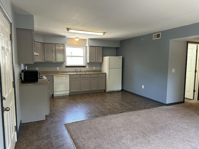 5451 S Bethel Church Rd Unit 3-301, Columbia, MO 65203 - kitchen with white appliances, a sink, gray cabinetry, and baseboards