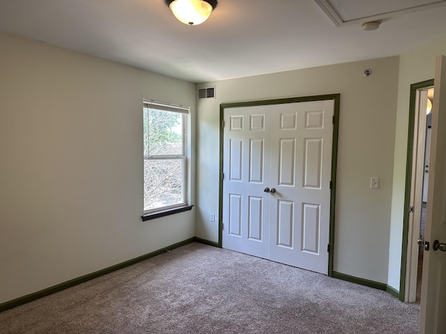 5451 S Bethel Church Rd Unit 3-301, Columbia, MO 65203 - unfurnished bedroom featuring carpet, baseboards, and a closet