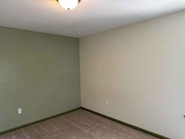 5451 S Bethel Church Rd Unit 3-301, Columbia, MO 65203 - spare room featuring dark colored carpet and baseboards