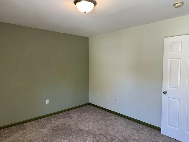 5451 S Bethel Church Rd Unit 3-301, Columbia, MO 65203 - spare room featuring dark colored carpet, baseboards, and a smoke detector