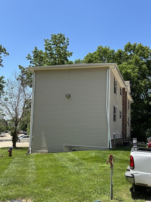5451 S Bethel Church Rd Unit 3-301, Columbia, MO 65203 - view of property exterior featuring a yard