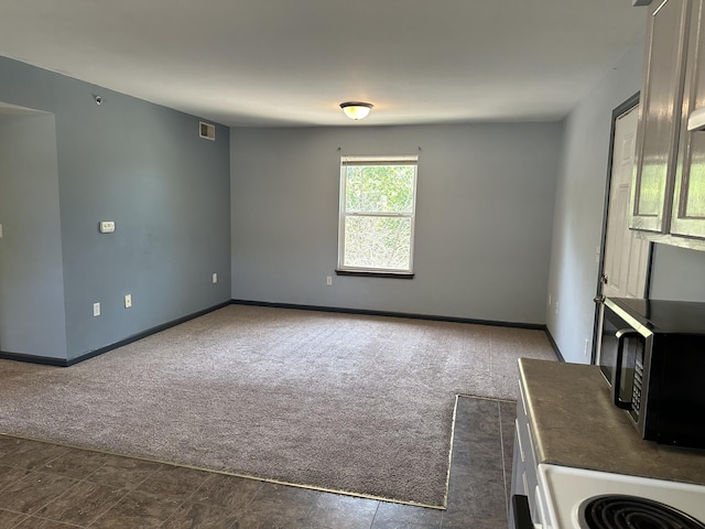 5451 S Bethel Church Rd Unit 3-301, Columbia, MO 65203 - empty room featuring dark carpet and baseboards