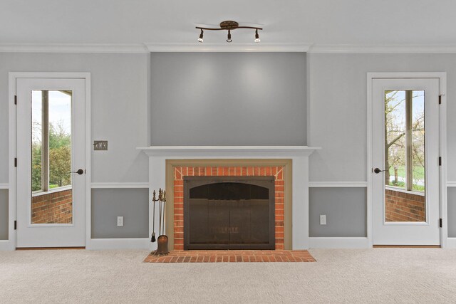 404 S Greenwood Ave, Columbia, MO 65203 - unfurnished living room with a brick fireplace, carpet, ornamental molding, and baseboards