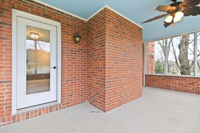 404 S Greenwood Ave, Columbia, MO 65203 - view of exterior entry featuring a ceiling fan and brick siding
