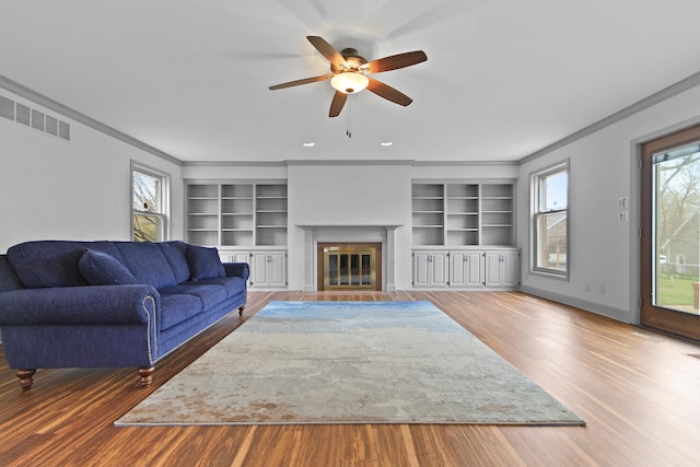 404 S Greenwood Ave, Columbia, MO 65203 - living room with plenty of natural light, ornamental molding, wood finished floors, and a ceiling fan